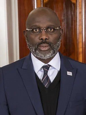 1966 – George Weah, Liberian footballer and politician, 25th President of Liberia